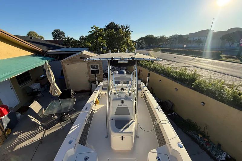 Slide: The Image of Pathfinder 2005 TRS boat parked in a residential driveway, sunny day, 2022 model. - 40