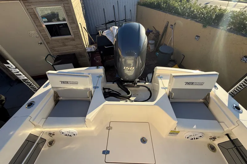 Slide: The Image of Pathfinder 2005 TRS boat with Yamaha 150 engine, outdoor setting, 2022 model. - 49