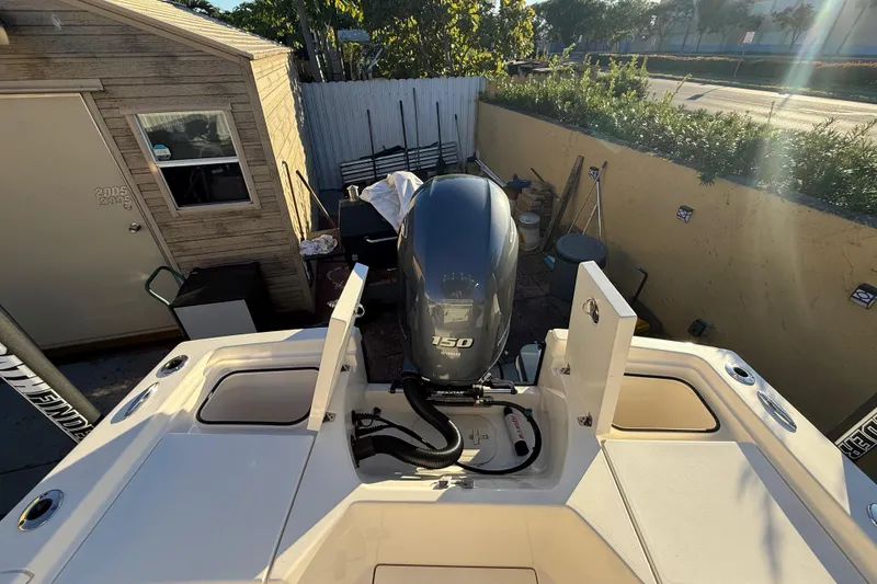 Slide: The Image of Pathfinder 2005 TRS boat with 150 horsepower engine, parked outdoors, 2022 model. - 50