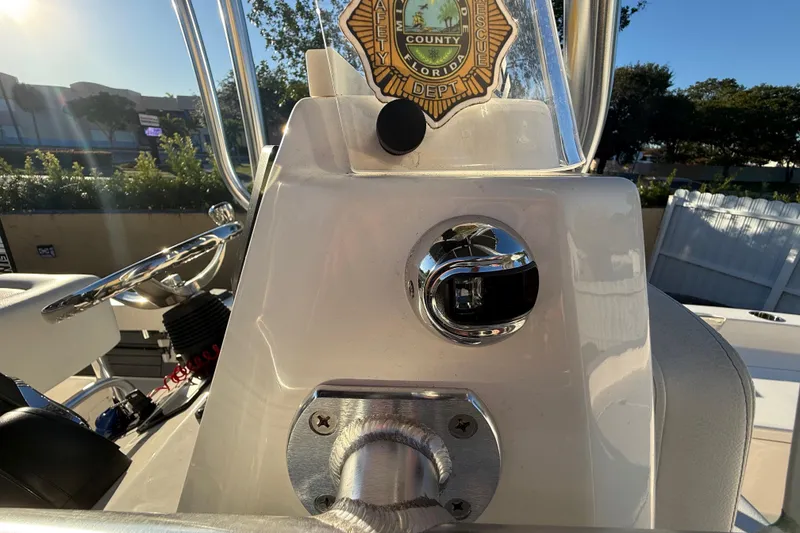 Slide: The Image of Control panel of a 2022 Pathfinder 2005 TRS boat with safety badge. - 56