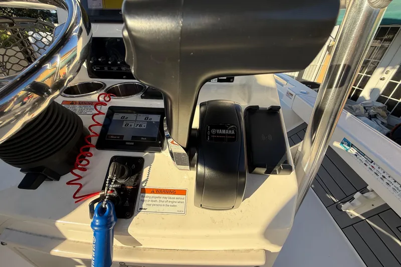 Slide: The Image of Control panel of 2022 Pathfinder 2005 TRS boat with Yamaha throttle and digital display. - 58
