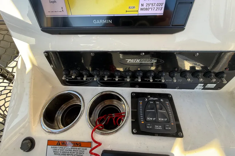 Slide: The Image of Control panel of a 2022 Pathfinder 2005 TRS boat with Garmin GPS display. - 60