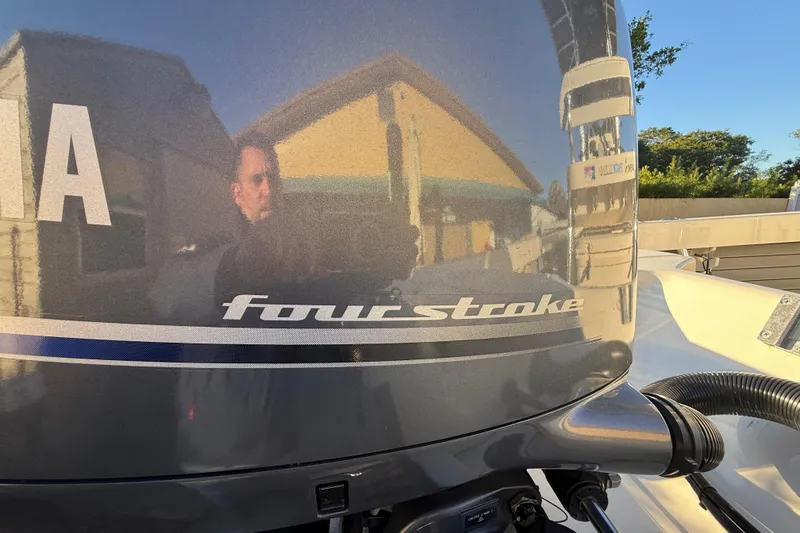Slide: The Image of Close-up of a Yamaha four-stroke engine on a 2022 Pathfinder 2005 TRS boat. - 64