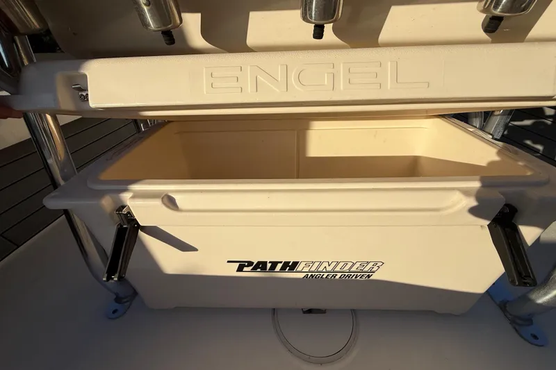 Slide: The Image of Open Engel cooler on Pathfinder 2005 TRS boat, showcasing storage space. - 68