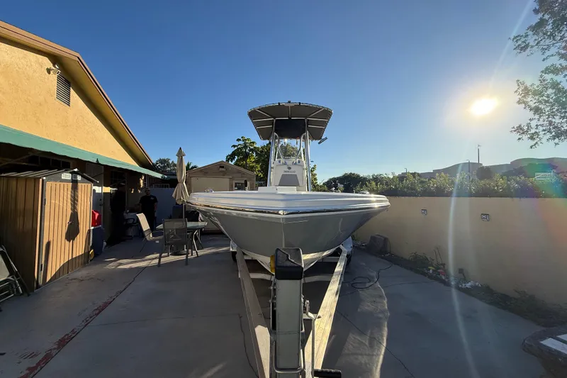 Slide: The Image of Pathfinder 2005 TRS boat on trailer in sunny backyard, 2022 model. - 7