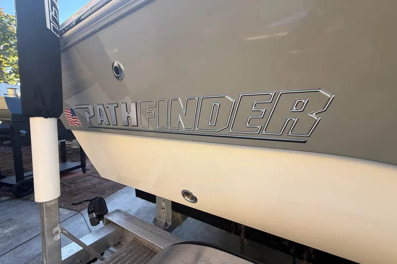 Slide: The Image of Side view of 2022 Pathfinder 2005 TRS boat with logo and American flag decal. - 75
