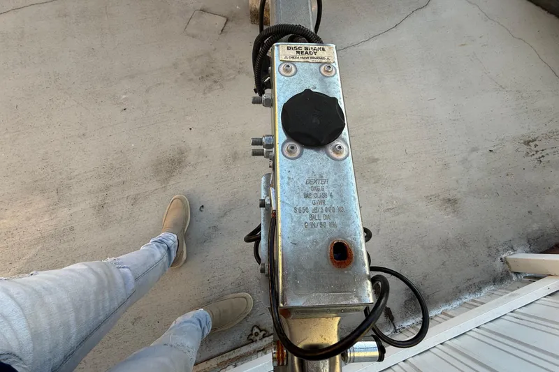 Slide: The Image of Top view of a 2022 Pathfinder 2005 TRS trailer hitch on concrete surface. - 77