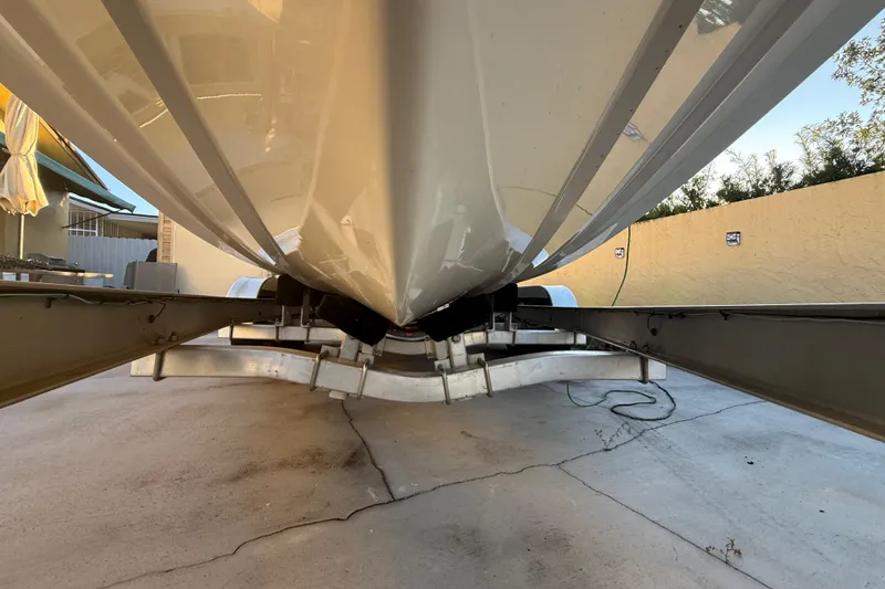 Slide: The Image of Underneath view of a 2022 Pathfinder 2005 TRS boat on a trailer. - 78