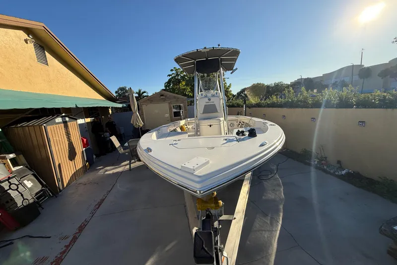 Slide: The Image of Pathfinder 2005 TRS boat in driveway, sunny day, 2022 model. - 8