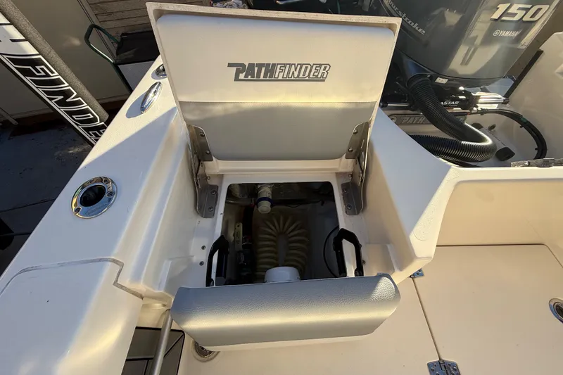 Slide: The Image of Open storage compartment on 2022 Pathfinder 2005 TRS boat, showing interior details. - 95