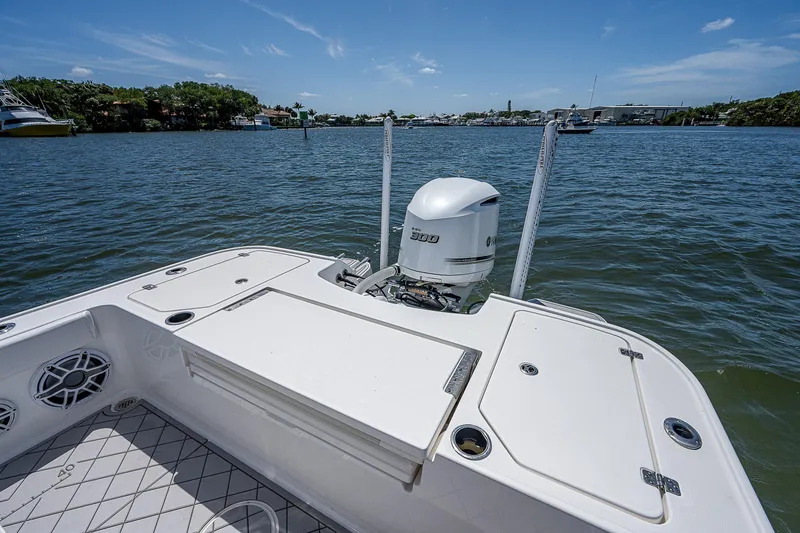 Slide: The Image of 2021 Caymas 26 HB boat with Yamaha 300 engine on calm water. - 17