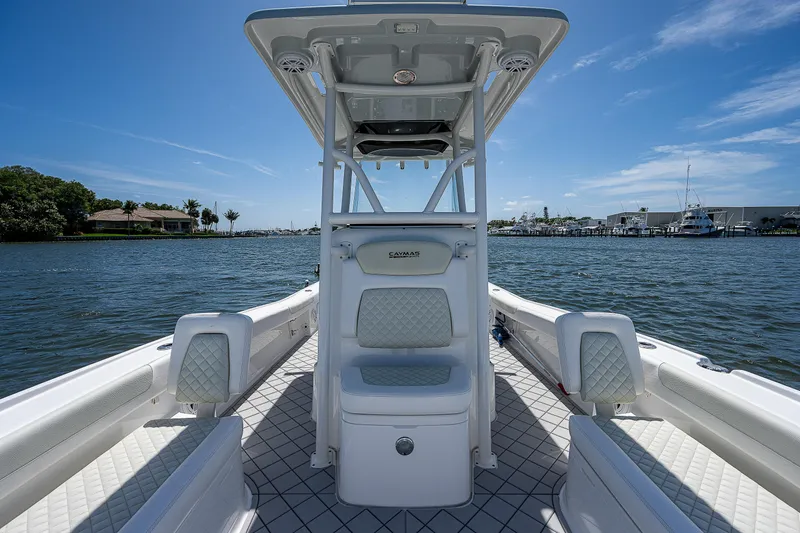 Slide: The Image of 2021 Caymas 26 HB boat on water, featuring sleek design and spacious seating. - 27