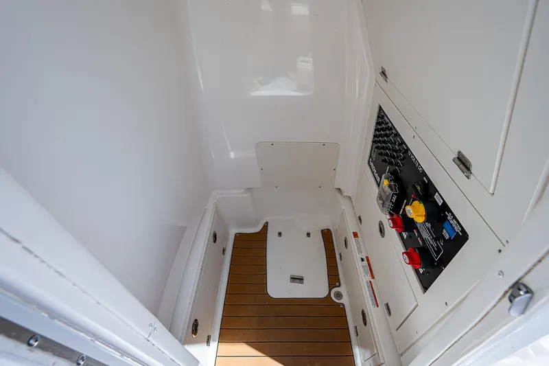 Slide: The Image of 2021 Caymas 26 HB boat interior with control panel and wooden flooring. - 35