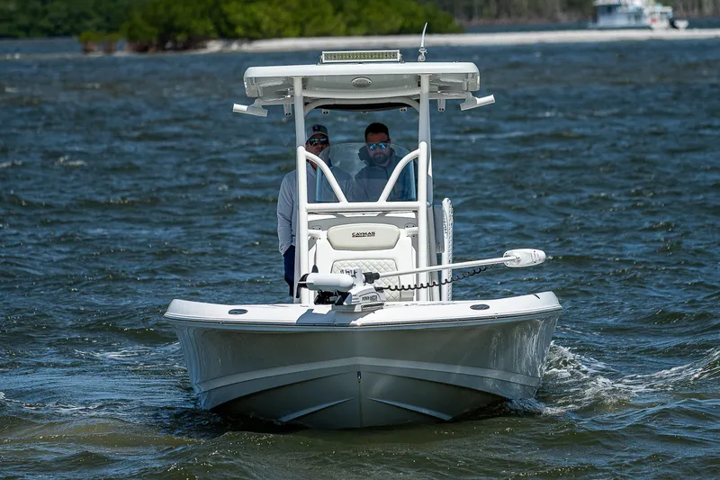 Slide: The Image of 2021 Caymas 26 HB boat navigating through choppy waters. - 7
