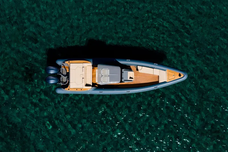 Slide: The Image of Top view of 2026 Rock Marine RM 30 boat on clear blue water. - 11