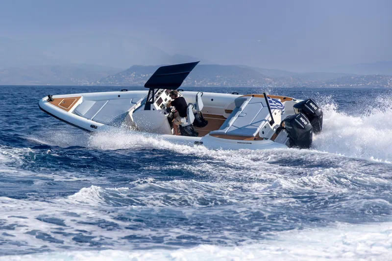 Slide: The Image of 2026 Rock Marine RM 30 speedboat cruising on open water with dual engines. - 4