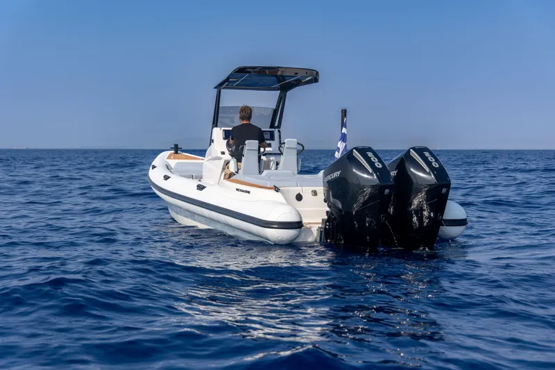 Slide: The Image of 2026 Rock Marine RM 30 boat cruising on open sea with dual Mercury engines. - 5