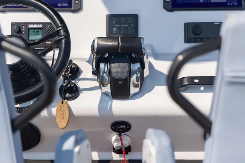 Slide: The Image of Control panel of 2026 Rock Marine RM 30 boat with steering wheel and throttle. - 7
