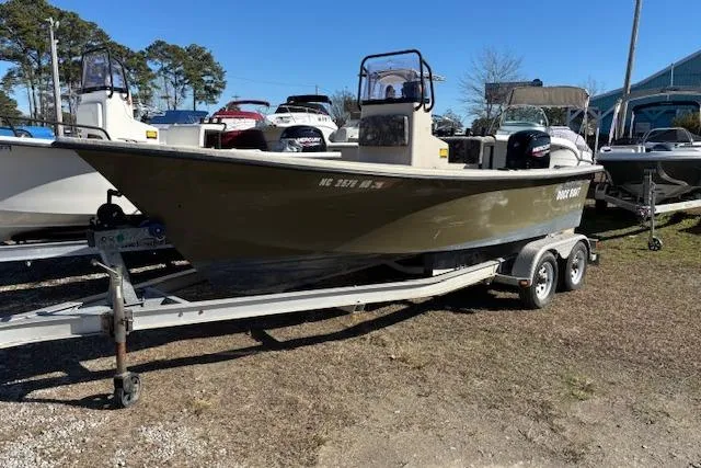 The Image of 2022 May-Craft 1800 Center Console boat on trailer, parked outdoors. - 1