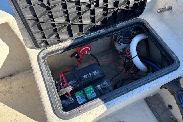 Slide: The Image of Battery compartment of 2022 May-Craft 1800 Center Console boat, showing wiring and components. - 12