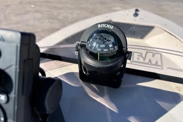 Slide: The Image of Compass on 2022 May-Craft 1800 Center Console boat dashboard, close-up view. - 15