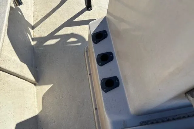 Slide: The Image of May-Craft 1800 Center Console 2022 boat deck with rod holders. - 19