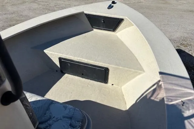 Slide: The Image of 2022 May-Craft 1800 Center Console boat, bow seating area with storage compartments. - 8