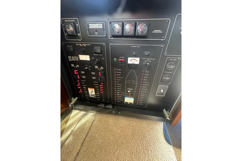 Slide: The Image of 1997 Bayliner 3988 Command Bridge Motoryacht control panel with gauges and switches. - 45