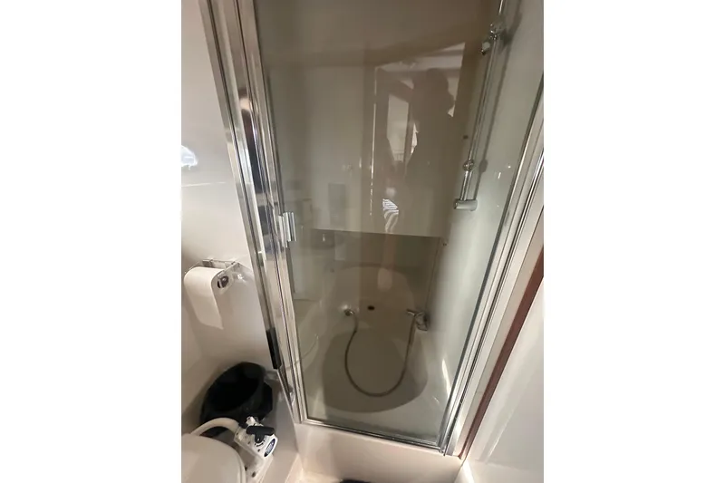 Slide: The Image of 1997 Bayliner 3988 Command Bridge Motoryacht bathroom with shower and toilet. - 50