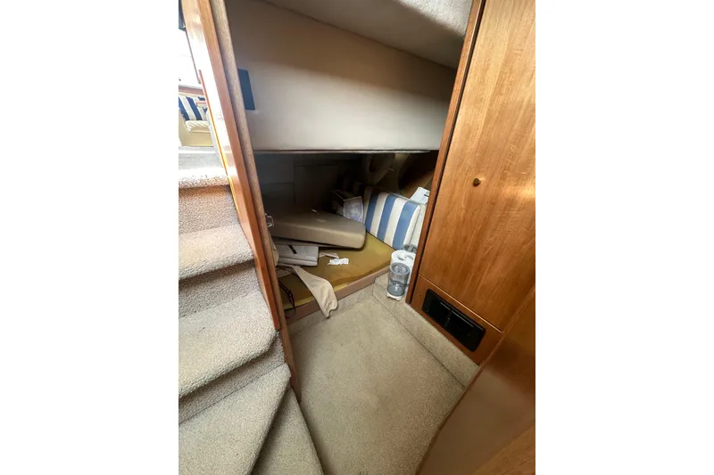 Slide: The Image of Interior cabin of 1997 Bayliner 3988 Command Bridge Motoryacht with stairs and storage area. - 53