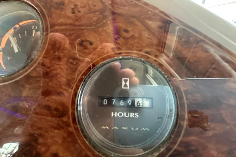 Slide: The Image of Maxum 4600 SCB 1999 dashboard showing 7696 hours on hour meter. - 12