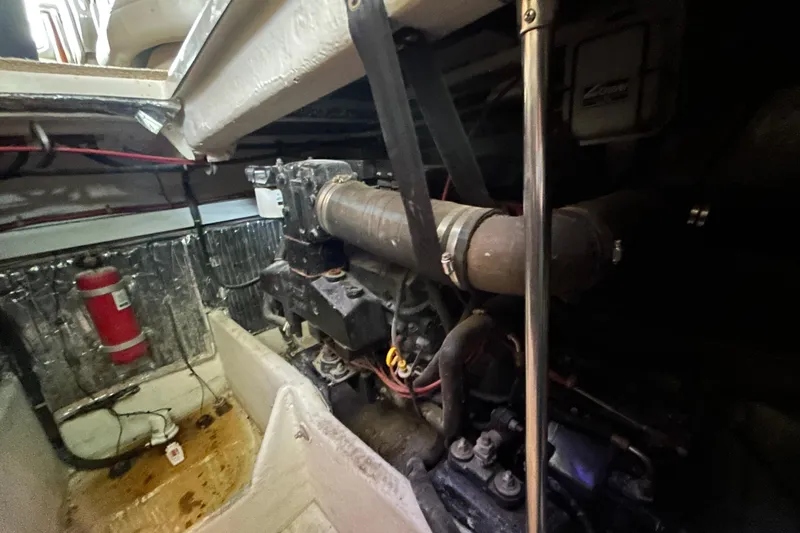 Slide: The Image of Luxurious cabin interior of 1999 Maxum 4600 SCB yacht with cozy bedding and wooden cabinetry. - 14