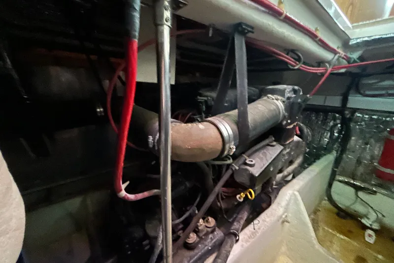 Slide: The Image of 1999 Maxum 4600 SCB yacht interior with TV, fan, and wooden cabinetry. - 15