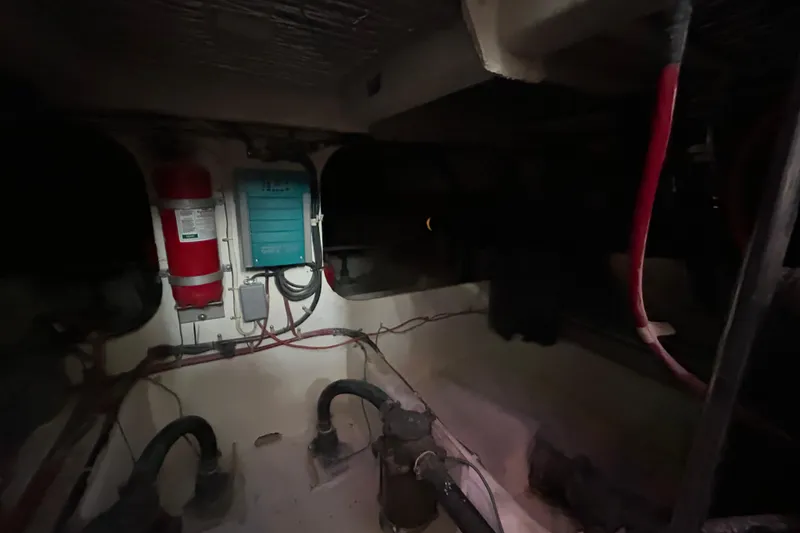 Slide: The Image of Bathroom interior of 1999 Maxum 4600 SCB yacht with sink, mirror, and porthole. - 16