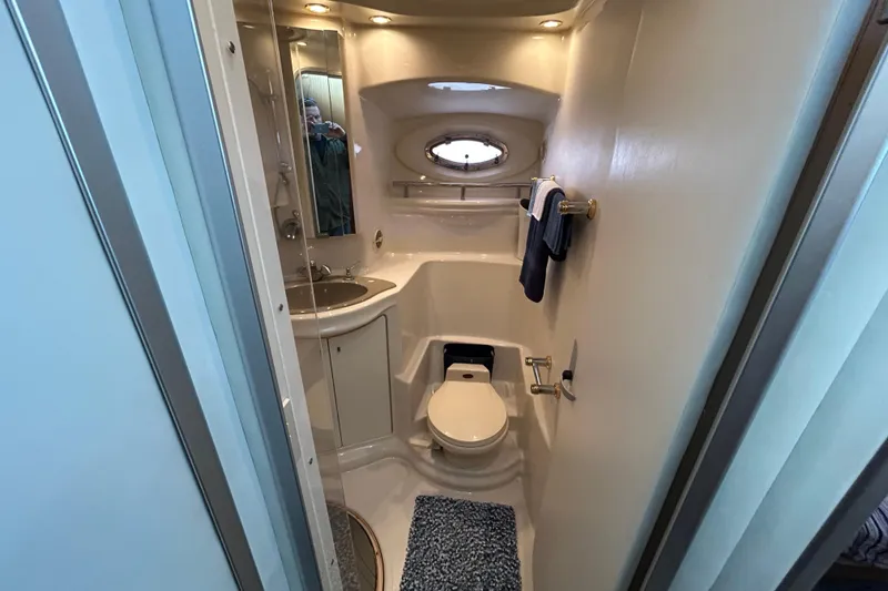 Slide: The Image of 1999 Maxum 4600 SCB yacht with reflective glass doors and interior view. - 26