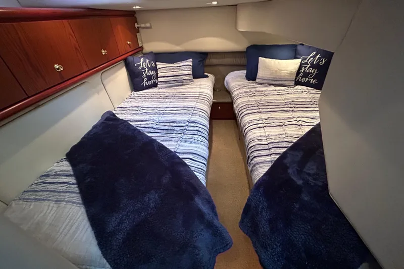 Slide: The Image of 1999 Maxum 4600 SCB helm with wood accents, Raymarine display, and Furuno equipment. - 28