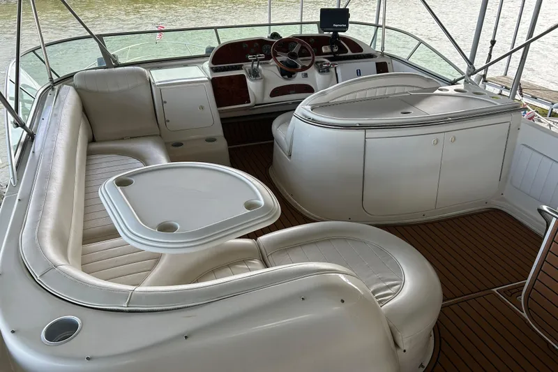 Slide: The Image of 1999 Maxum 4600 SCB yacht interior with wooden deck and modern design. - 38