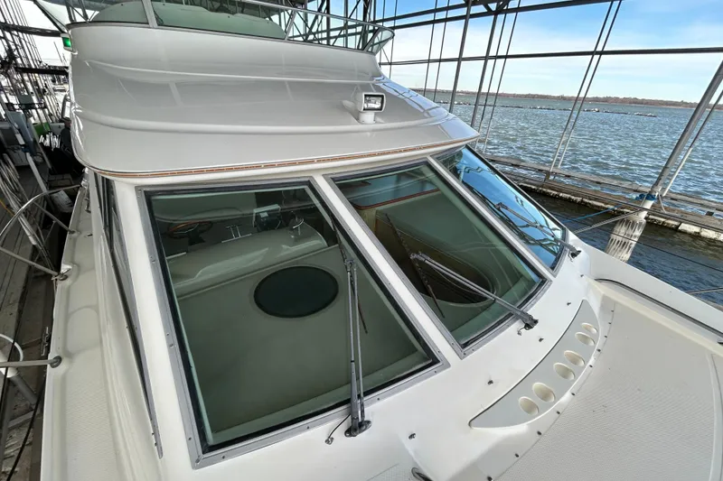 Slide: The Image of Red engine of a 1999 Maxum 4600 SCB boat, showing detailed components. - 42