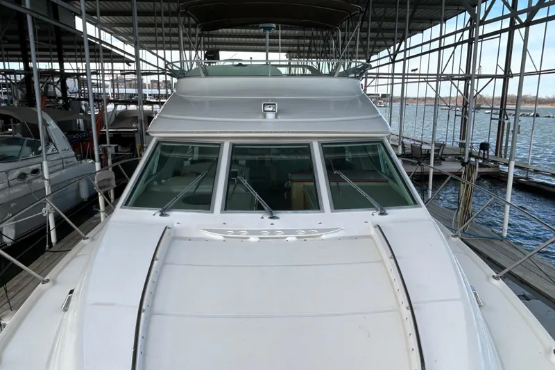 Slide: The Image of 1999 Maxum 4600 SCB yacht with blue lighting, docked in Highland Village, TX. - 44