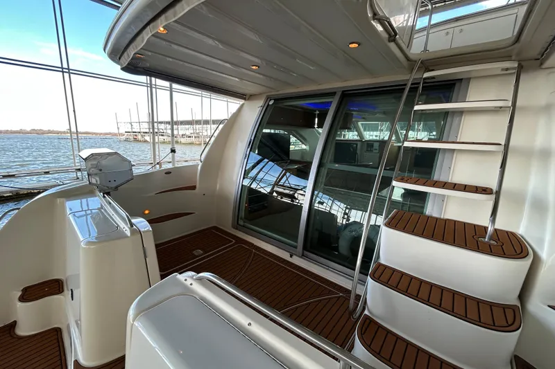 Slide: The Image of 1999 Maxum 4600 SCB yacht with blue interior lights in a covered dock. - 45