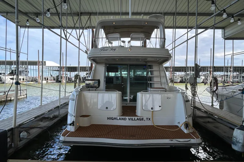 Slide: The Image of 1999 Maxum 4600 SCB yacht interior with blue ambient lighting and modern furnishings. - 50