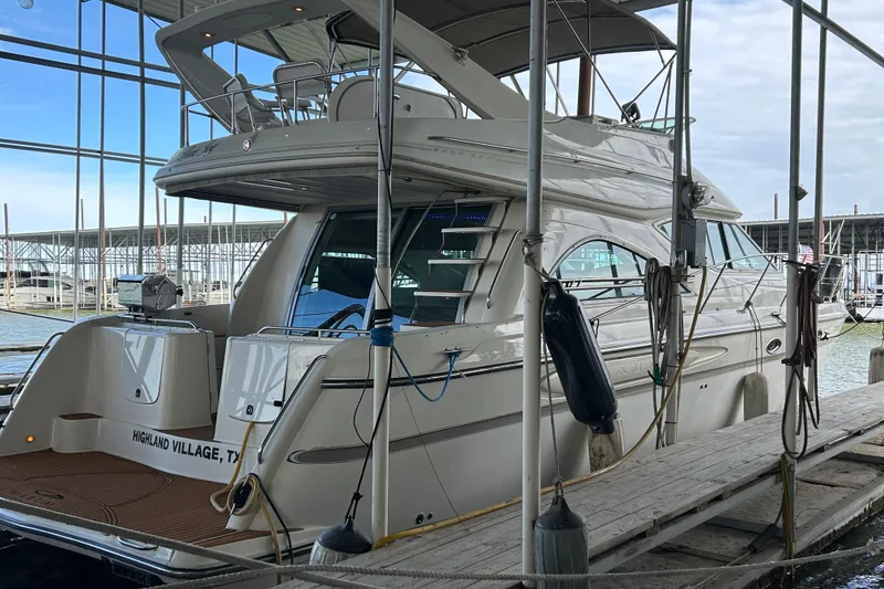 Slide: The Image of Engine compartment of 1999 Maxum 4600 SCB boat, showcasing mechanical components. - 52