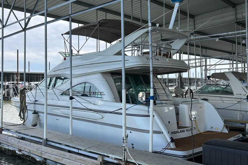 Slide: The Image of Engine compartment of a 1999 Maxum 4600 SCB boat, featuring visible wiring and components. - 53