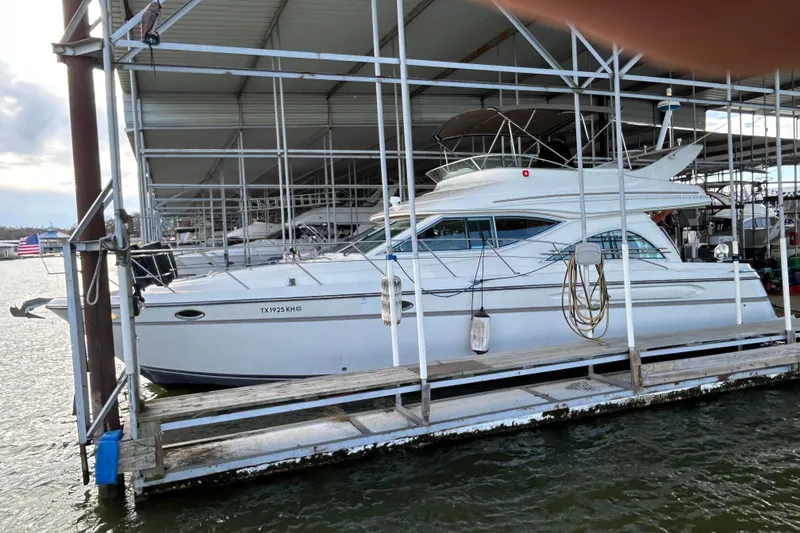 Slide: The Image of Engine compartment of a 1999 Maxum 4600 SCB boat, featuring visible wiring and components. - 55