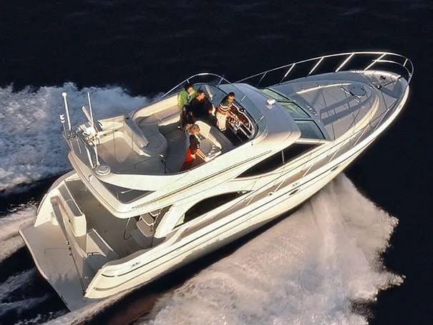 Slide: The Image of 1999 Maxum 4600 SCB yacht cruising with passengers. - 7