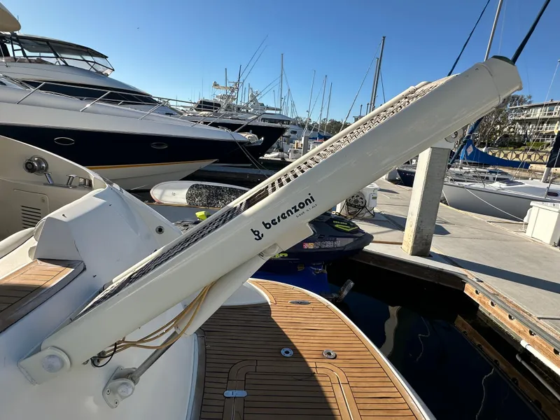 Slide: The Image of Aicon 56 Flybridge 2003 yacht with Barenzoni crane at marina dock. - 12