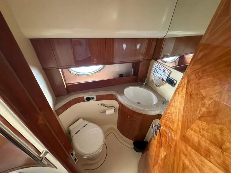 Slide: The Image of Luxurious bathroom in 2003 Aicon 56 Flybridge yacht with wood accents and modern fixtures. - 19