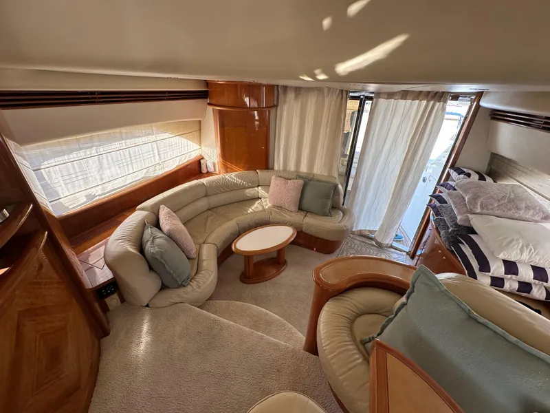 Slide: The Image of Luxurious interior of 2003 Aicon 56 Flybridge yacht with plush seating and elegant decor. - 24
