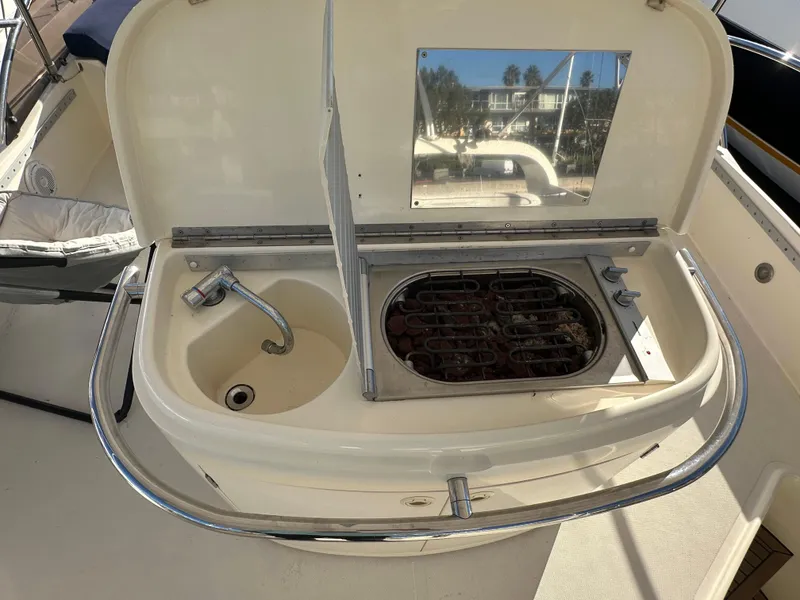Slide: The Image of Aicon 56 Flybridge 2003 yacht kitchenette with sink and grill on deck. - 7