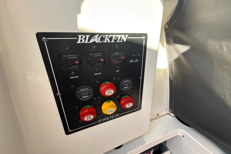 Slide: The Image of Control panel of 2019 Blackfin 242 CC boat with switches and indicators. - 22